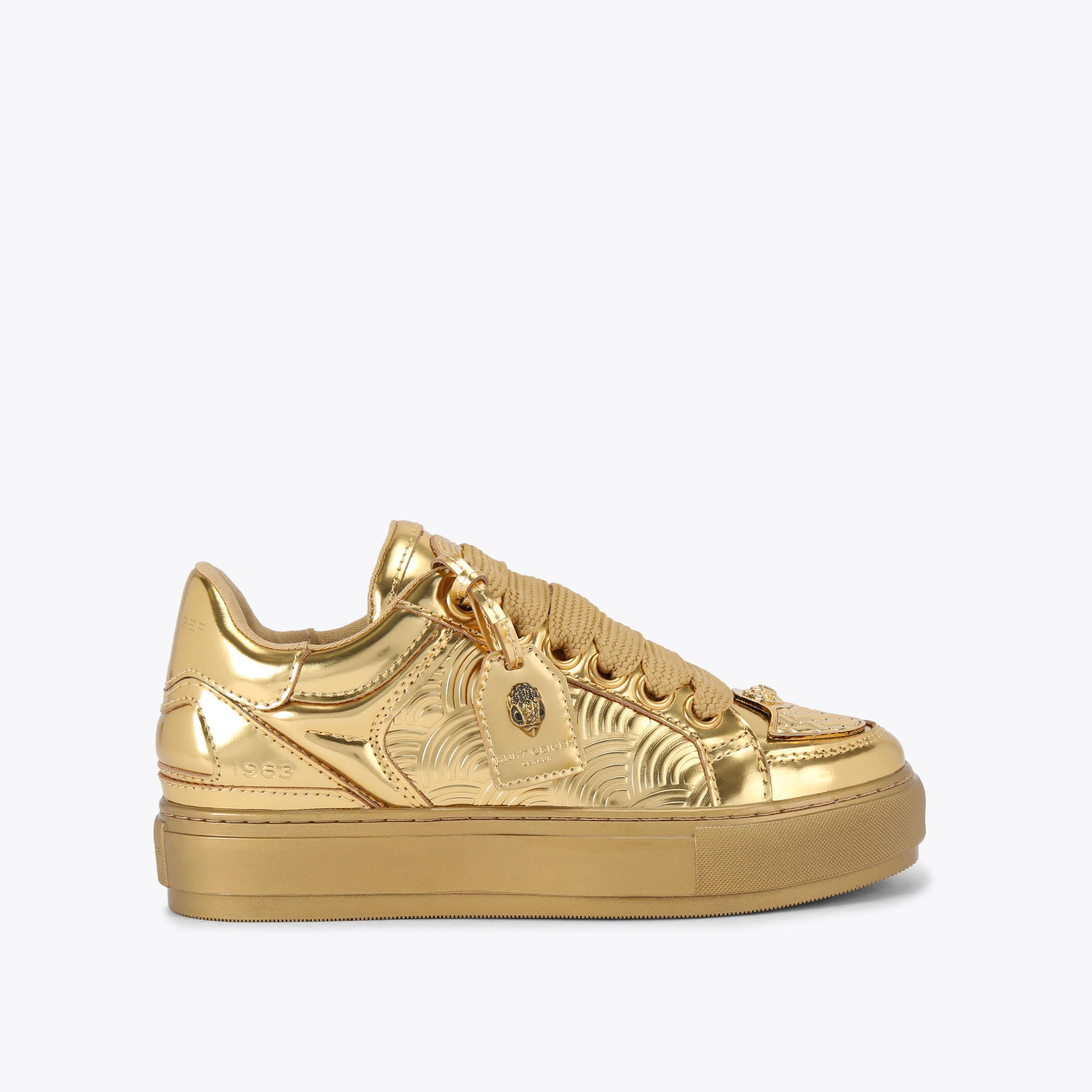 Gold tennis shoes hotsell