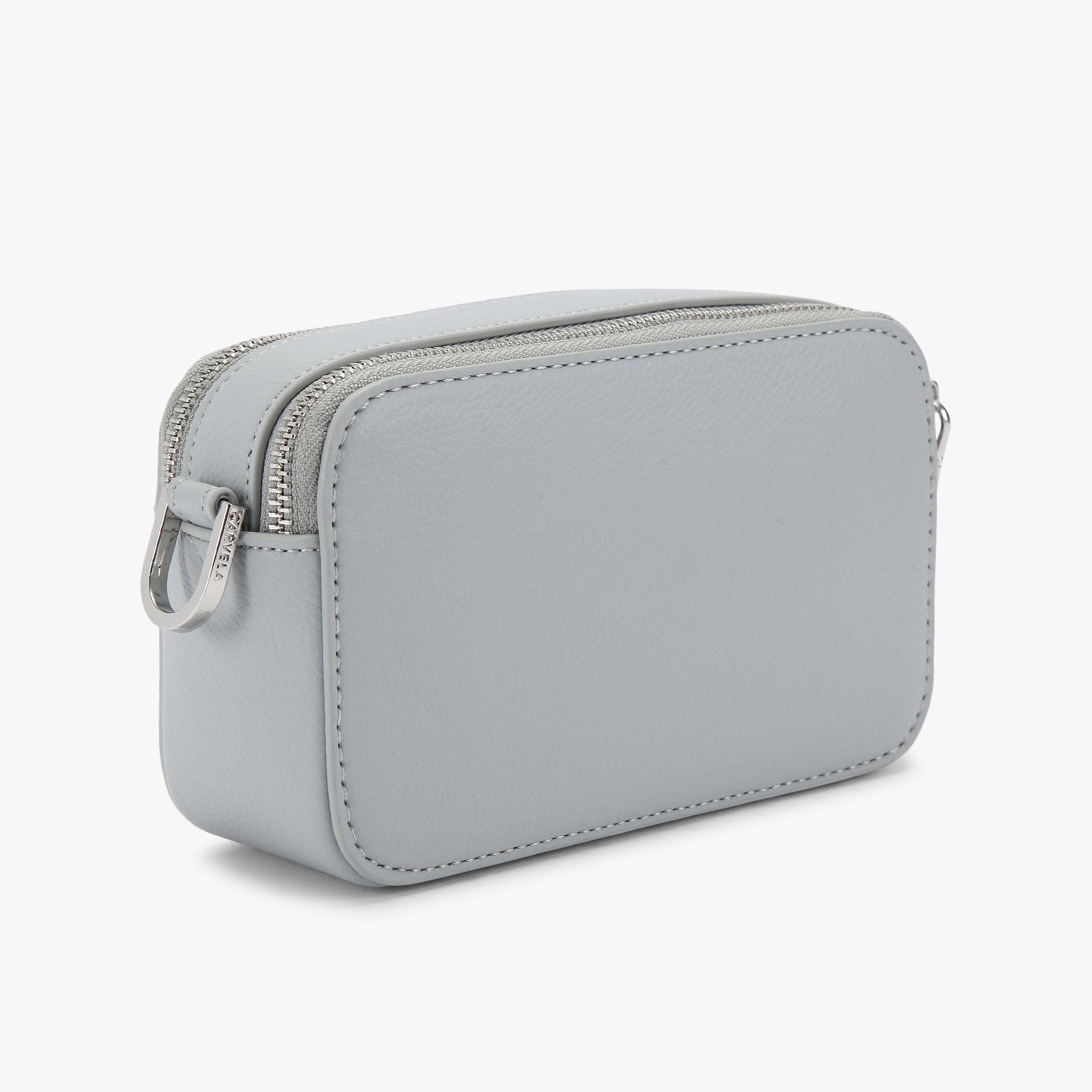 MINI ROMA CIRCLE Pale Blue Mini Circle Camera Bag by CARVELA